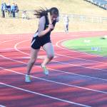 Homer&rsquo;s Marina Carroll takes off from her blocks as the first leg of the girls&rsquo; 1,600-meter relay Friday, April 13, 2018 at Homer High School in Homer, Alaska. The Homer High track and field team faced off against Soldotna High School in a dual meet. (Photo by Megan Pacer/Homer News)