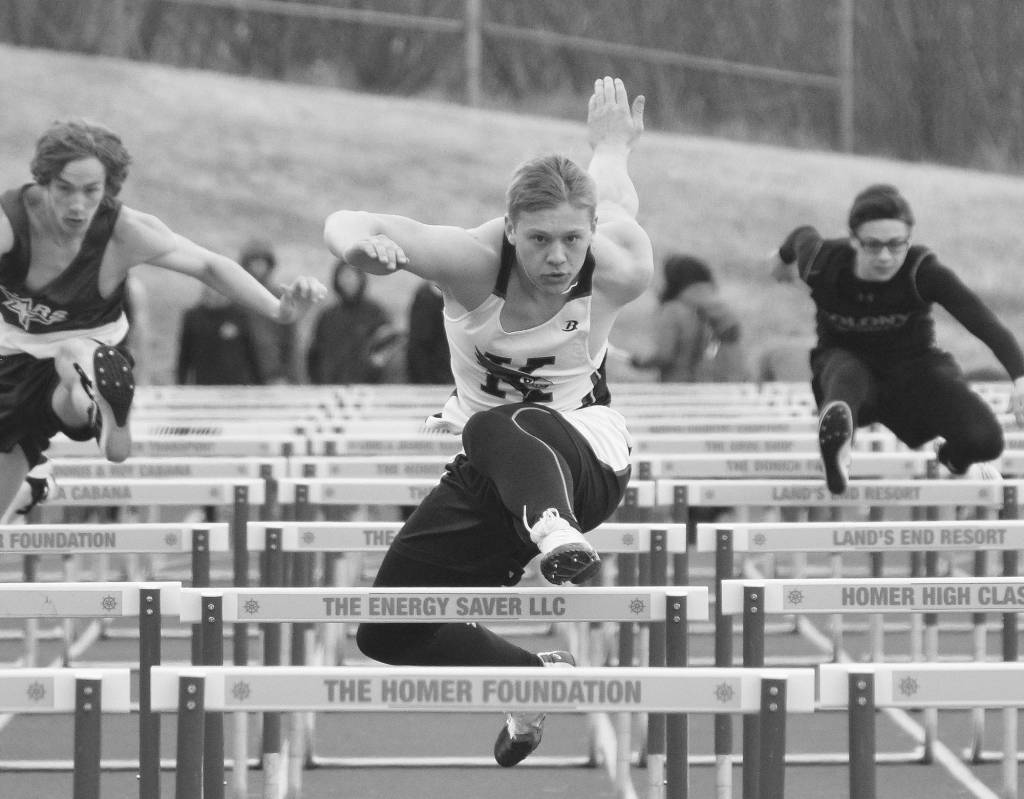 Photo by Joey Klecka/Peninsula Clarion Kenai Central junior Jarett Wilson eyes the finish of the boys 110-meter hurdles Saturday, April 21 at Homer High School.