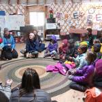 A group of Little Fireweed and Homer High School students talk about their morning together learning about the outdoors with teacher Kim Fine on Tuesday, April 24, 2018 at the school in Homer, Alaska. (Photo by Megan Pacer/Homer News)