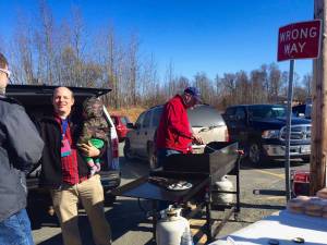Public education supporters gather for a barbecue in the parking lot behind the George A. Navarre Borough Administration Building before the Kenai Peninsula Borough Assembly&rsquo;s meeting on Tuesday, May 1, 2018 in Soldotna, Alaska. Teachers, parents and school district administrators turned out in force to ask the assembly to increase funding to the Kenai Peninsula Borough School District on Tuesday. The assembly agreed to at least provide as much funding as it did in fiscal year 2018, but with a deficit in the borough budget, the source of the funding is still unclear. (Photo by Elizabeth Earl/Peninsula Clarion)