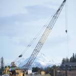 Workers with Jay-Brant Construction, Homer, put in a coffer dam on Lake Street at Beluga Lake last Friday, May 4. The project will replace the dam at the lake to better control water levels. Culverts also will be relined. Drivers can expect delays and one-lane traffic. Construction is scheduled to be done by mid-July. (Photo by Michael Armstrong/Homer News)