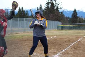 Kenai&rsquo;s Alyssa St….? catches a high ball that Homer&rsquo;s Brianna Hetrick let pass by during their softball game Tuesday, May 8, 2018 in Jack Gist Park in Homer, Alaska. (Photo by Megan Pacer/Homer News)