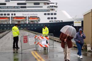 Passengers from the cruise ship Amsterdam brave the rain at the ship&rsquo;s last docking on Aug. 17, 2011. (Photo by Michael Armstrong / Homer News)