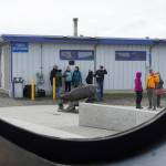 Wildheart, the Giving Salmon sculpture, and the Ramp 2 restroom are framed in a window of the Boat House Saturday, May 12, 2018 at the Homer Harbor. (Photo by Michael Armstrong/Homer News)