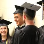 Kachemak Bay Campus graduate Pedro Ochoa Jr. (center) laughs with classmates before their commencement ceremony Wednesday, May 9, 2018 at Homer High School in Homer, Alaska. (Photo by Megan Pacer/Homer News)