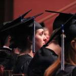 Kachemak Bay Campus graduates listen during their commencement ceremony Wednesday, May 9, 2018 at Homer High School in Homer, Alaska. (Photo by Megan Pacer/Homer News)