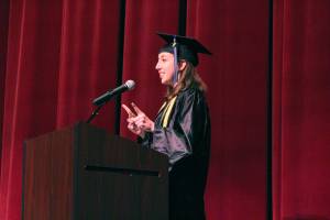 Kachemak Bay Campus graduate Delenia Cosman gives her valedictorian address during the commencement ceremony for the community college&rsquo;s 2018 class Wednesday, May 9, 2018 at Homer High School in Homer, Alaska. Cosman earned her associate of arts degree. (Photo by Megan Pacer/Homer News)