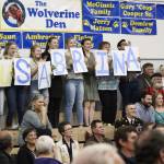 Ninilchik School students hold up signs spelling out &ldquo;(Heart) U Sabrina&rdquo; while 2018 graduate Sabrina Ferguson walks across the stage to claim her diploma Monday, May 21, 2018 during a ceremony at the school in Ninilchik, Alaska. (Photo by Megan Pacer/Homer News)