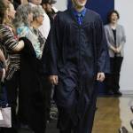 Ninilchik School graduate Robert McGinnis walks into his graduation ceremony Monday, May 21, 2018 at the school in Ninilchik, Alaska. (Photo by Megan Pacer/Homer News)