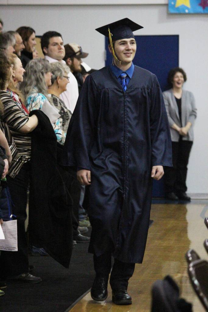 Ninilchik School graduate Robert McGinnis walks into his graduation ceremony Monday, May 21, 2018 at the school in Ninilchik, Alaska. (Photo by Megan Pacer/Homer News)