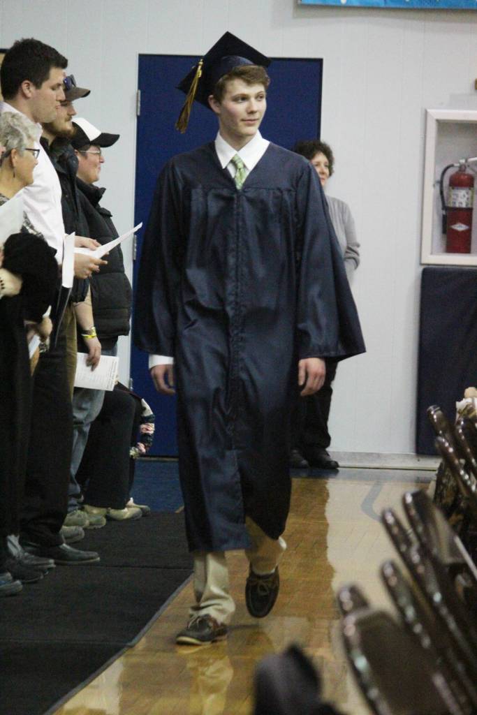 Ninilchik School graduate Nicholas Kelson walks into his graduation ceremony Monday, May 21, 2018 at the school in Ninilchik, Alaska. (Photo by Megan Pacer/Homer News)