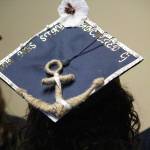 Photo by Megan Pacer/Homer News Ninilchik School graduate Chelsea Oberle-Lozano waits with her classmates to walk into their graduation ceremony Monday, May 21, 2018 at the school in Ninilchik, Alaska. Her graduation cap reads: &ldquo;Stay anchored.&rdquo;