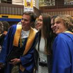 Homer High School graduates Denver Waclawski (far left) and Jacob Davis (far right) pose with friends for a photo after their commencement ceremony Tuesday, May 22, 2018 at the school in Homer, Alaska. (Photo by Megan Pacer/Homer News)