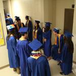 Homer High School graduates await their ceremony outside the Alice Witte Gymnasium on Tuesday, May 22, 2018 at the school in Homer, Alaska. (Photo by Megan Pacer/Homer News)