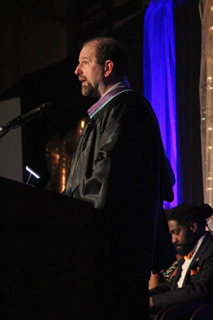 Homer High School Principal Douglas Waclawski welcomes guests to the graduation ceremony for the class of 2018 on Tuesday, May 22, 2018 at the school in Homer, Alaska. Waclawski&rsquo;s son, Denver, was among the evening&rsquo;s graduates and one of the four valedictorians. (Photo by Megan Pacer/Homer News)