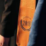 Right: A sash reading &ldquo;Class of 2018&rdquo; hangs from a graduate performing with the Homer High School Concert Choir during the class&rsquo;s commencement ceremony Tuesday, May 22 at the school in Homer. (Photo by Megan Pacer/Homer News) Left: Ninilchik School graduate Joshua Wood listens to a speaker during his graduation ceremony Monday, May 21 at the school in Ninilchik. Wood plans to enter the emergency medical response field. (Photo by Megan Pacer/Homer News)