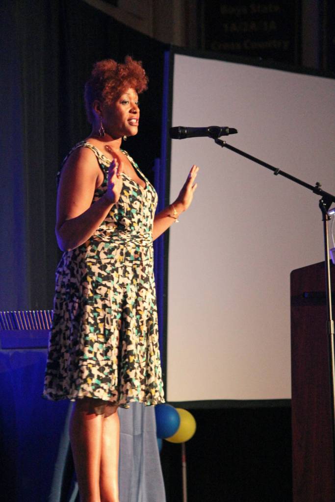 Performance artist Dasha Kelly Hamilton performs a slam poem for this year&rsquo;s Homer High School graduates during the commencement address she gave with her husband and fellow poet Kima Hamilton on Tuesday, May 22, 2018 at the school in Homer, Alaska. The pair travel to schools around the country, including Homer, to teach the writing and performance of poetry. (Photo by Megan Pacer/Homer News)