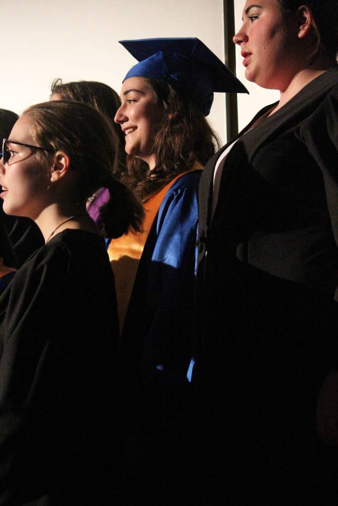 Senior Chloe Pleznac sings with the Homer High School Concert Choir during the graduation ceremony for her and her classmates Tuesday, May 22, 2018 at the school in Homer, Alaska. (Photo by Megan Pacer/Homer News)