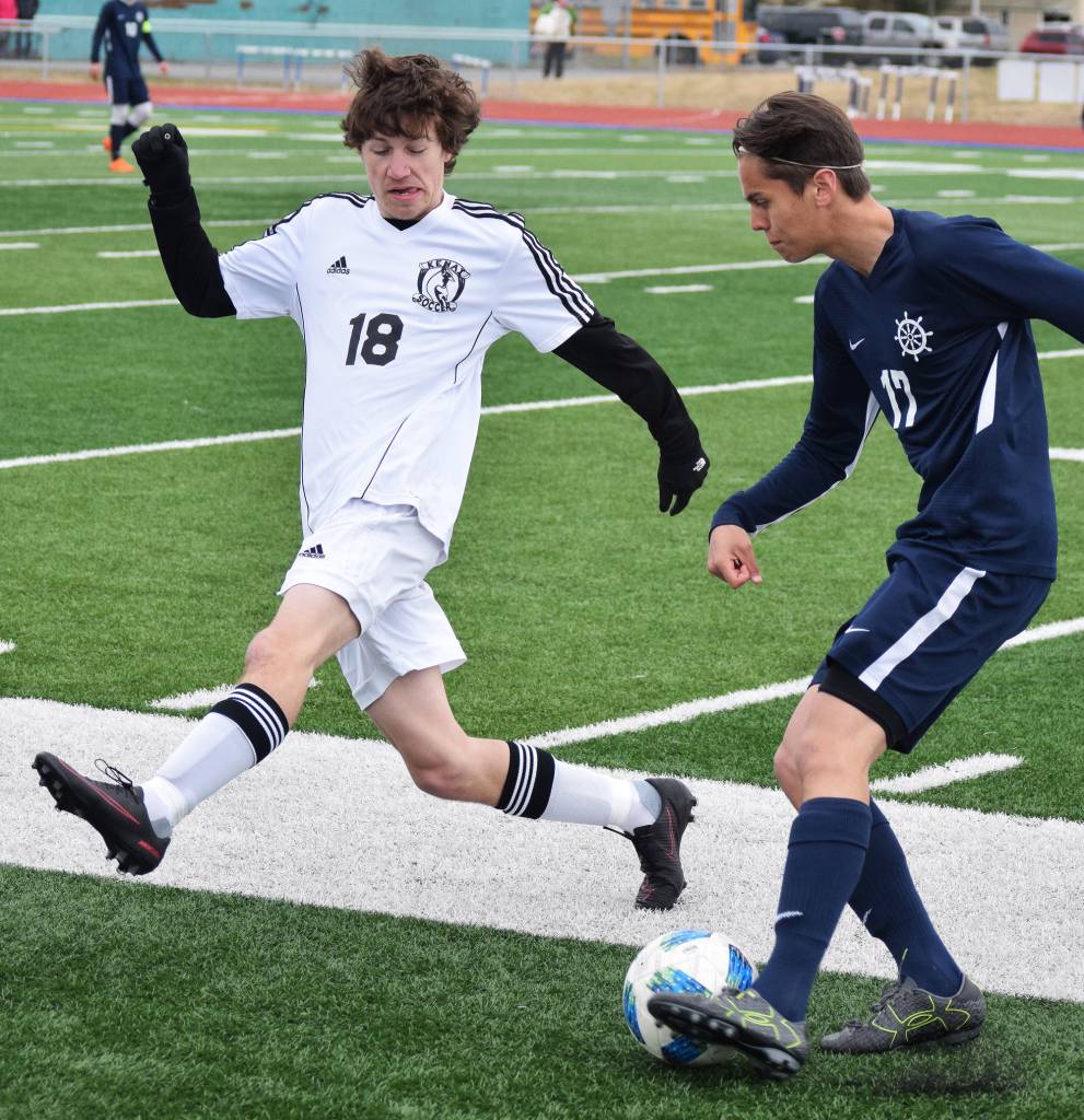 Kenai&rsquo;s Damien Redder attempts to win the ball from Homer&rsquo;s Isaiah Nevak Saturday in the Peninsula Conference boys soccer championship at Soldotna High School. (Photo by Joey Klecka/Peninsula Clarion)