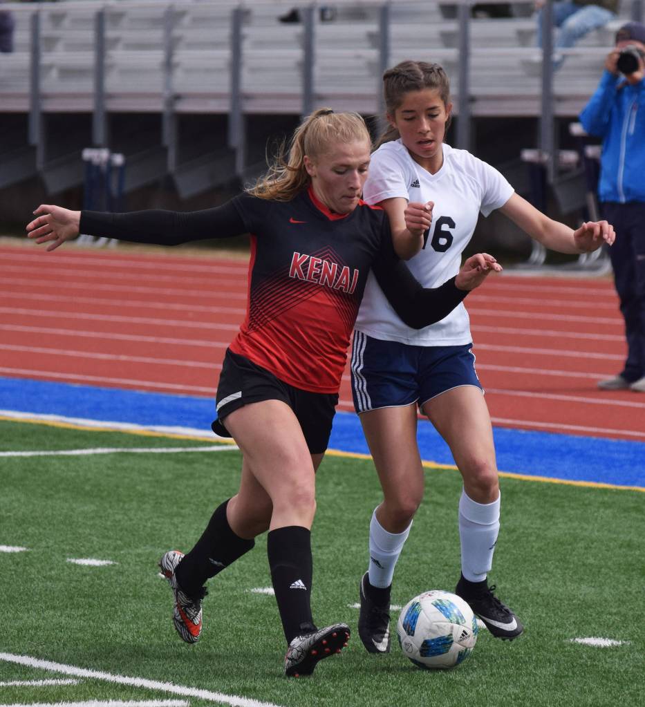 Kenai Central&rsquo;s Damaris Severson (left) battles for the ball with Soldotna&rsquo;s Sierra Kuntz Saturday in the Peninsula Conference girls soccer championship at Soldotna High School. (Photo by Joey Klecka/Peninsula Clarion)