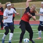 Kenai&rsquo;s Anya Danielson (right) keeps the ball from Homer&rsquo;s Jessica Sonnen (11) Friday in a Peninsula Conference tournament semifinal at Soldotna High School. (Photo by Joey Klecka/Peninsula Clarion)