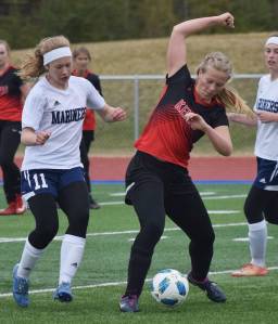 Kenai&rsquo;s Anya Danielson (right) keeps the ball from Homer&rsquo;s Jessica Sonnen (11) Friday in a Peninsula Conference tournament semifinal at Soldotna High School. (Photo by Joey Klecka/Peninsula Clarion)
