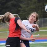 Photo by Joey Klecka/Peninsula Clarion Homer&rsquo;s Paige Jones (right) collides with Kenai&rsquo;s Liz Hanson on a header Friday, May 18 in a Peninsula Conference tournament semifinal at Soldotna High School.