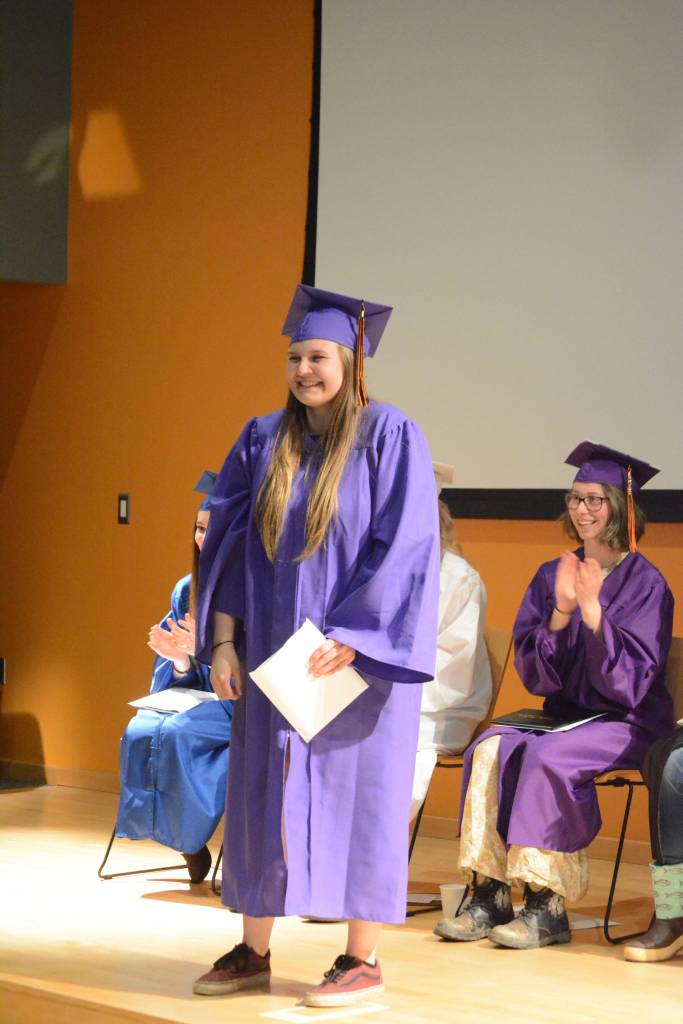 Flex High School graduate McKenzie Hill smiles after graduating. Nine students graduated from Flex on Tuesday night, May 22, 2018, at the Alaska Islands and Ocean Visitor Center auditorium, Homer, Alaska. (Photo by Michael Armstrong / Homer News)