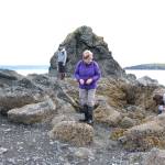 Saskia Esslinger (left), Marcia Kuszmaul (middle) and Caitlin Marsteller (right) explore Otter Island during an excursion to Peterson Bay on Thursday, May 24, 2018 near Homer, Alaska. (Photo by Megan Pacer/Homer News)