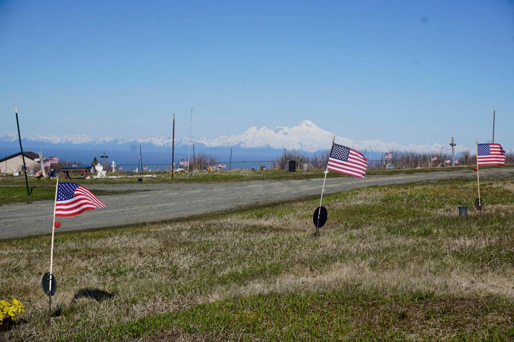 American flags decorate the graves of veterans on Memorial Day, May 28, 2018, at Hickerson Memorial Cemetery, Homer. Veterans buried there have served in World War I, World War II, the Korean War and the Vietnam War. (Photo by Michael Armstrong / Homer News)
