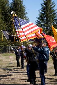 Members of the American Legion and the Veterans of Foreign Wars hold flags on Memorial Day, May 28, 2018, at Hickerson Memorial Cemetery, Homer, for services there. (Photo by Michael Armstrong / Homer News)