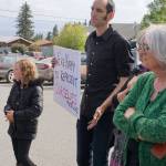 Mark Tanski holds a sign that says "We're happy to represent ourselves" after Homer Mayor Bryan Zak read a Mayoral Recognition recognizing June as Homer Pride Month at about 6 p.m. Monday, June 11, 2018 outside Homer City Hall in Homer, Alaska. A crowd of about 75 people attended in support of Pride Month. Council members Shelly Erickson, Heath Smith and Thomas Stroozas notified the city clerk that they would not attend the June 11 meeting, forcing its cancellation because of lack of a quorum. (Photo by Michael Armstrong/Homer News)