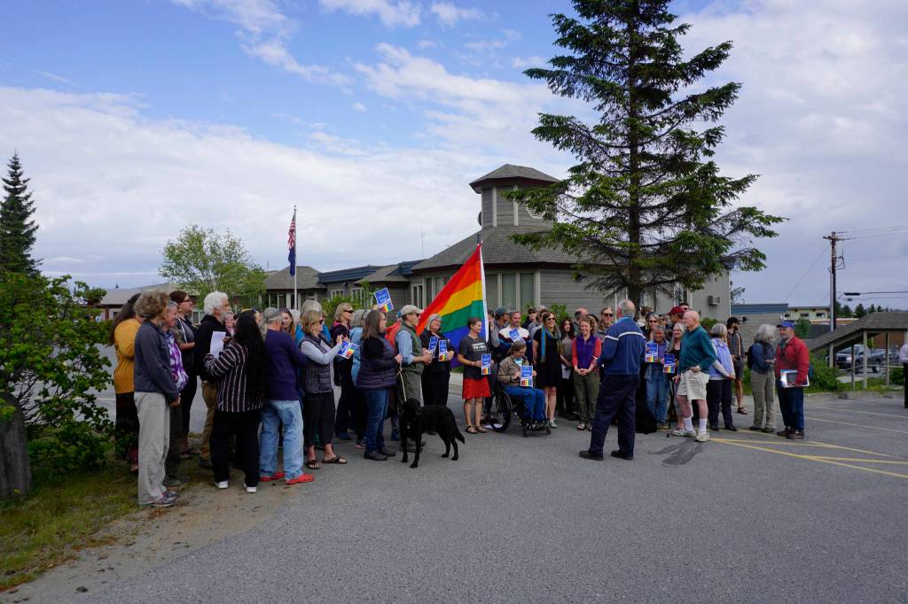 Homer Mayor Bryan Zak reads a Mayoral Recognition recognizing June as Homer Pride Month at about 6 p.m. Monday, June 11, 2018 outside Homer City Hall in Homer, Alaska. A crowd of about 75 people attended in support of Pride Month. Council members Shelly Erickson, Heath Smith and Thomas Stroozas notified the city clerk that they would not attend the June 11 meeting, forcing its cancellation because of lack of a quorum. (Photo by Michael Armstrong/Homer News)