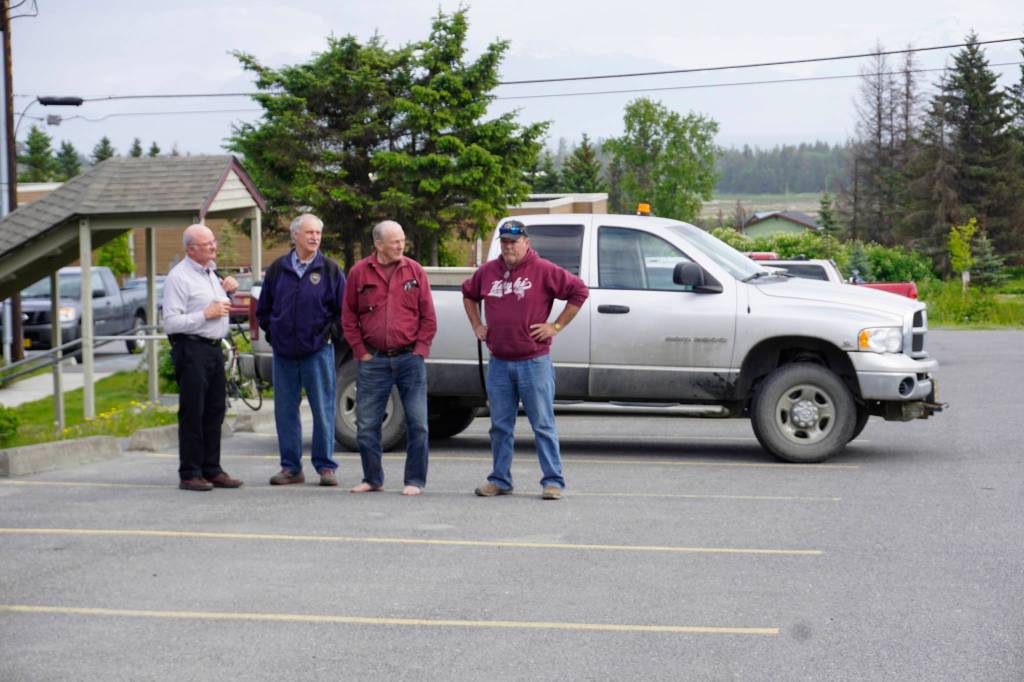 A man, right, glares at Mayor Bryan Zak as he read a Mayoral Recognition recognizing June as Homer Pride month Monday, June 11, 2018, at Homer City Hall in Homer, Alaska. The man yelled "Shame on you Bryan!" as he drove into the parking lot. (Photo by Michael Armstrong/Homer News)