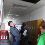 Members of the public and of the Homer Education and Recreation Complex Task Force inspect one of the two HERC buildings on Tuesday, June 26, 2018 during a walk-through of the complex in Homer, Alaska. The task force is gathering information to evaluate possible future uses for the HERC. (Photo by Megan Pacer/Homer News)