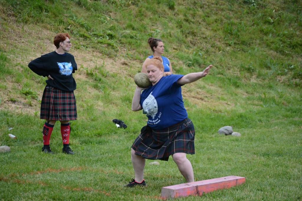 Brandi Neutermann throws the Braemar stone in the July 3, 2017 Kachemak Bay Scottish Club Games last Saturday at Karen Hornaday Park. (Photo by Michael Armstrong/Homer News)