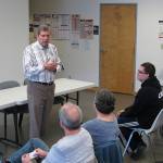 In this June 28, 2018, photo, Democrat Mark Begich, a candidate for governor in Alaska and a former U.S. senator, speaks during a meet-and-greet event at a labor hall in Juneau, Alaska. Begich is seeking to ease concerns some have about his entry into the race, saying he would not be running if he did not think he could win. The race is shaping up to be a three-way, general election contest between Begich, independent Gov. Bill Walker and the eventual Republican nominee. (AP Photo/Becky Bohrer)