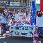 Representatives of the Homer Senior Citizens Center march and dance in this years Independence Day parade Wednesday, July 4, 2018 in Homer, Alaska. (Photo by Megan Pacer/Homer News)