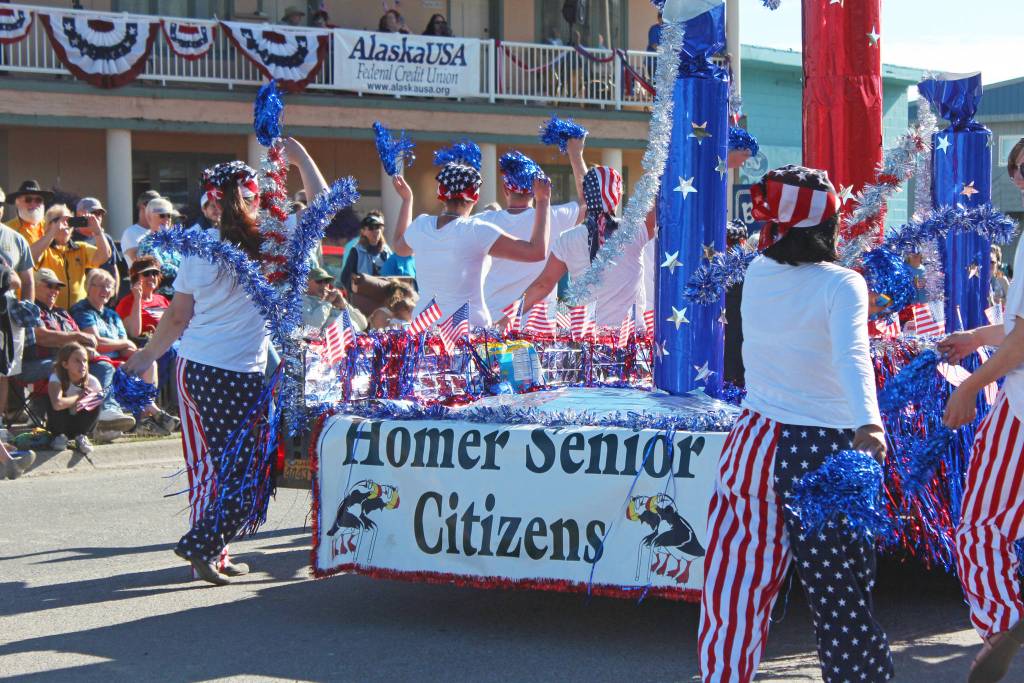 Representatives of the Homer Senior Citizens Center march and dance in this years Independence Day parade Wednesday, July 4, 2018 in Homer, Alaska. (Photo by Megan Pacer/Homer News)