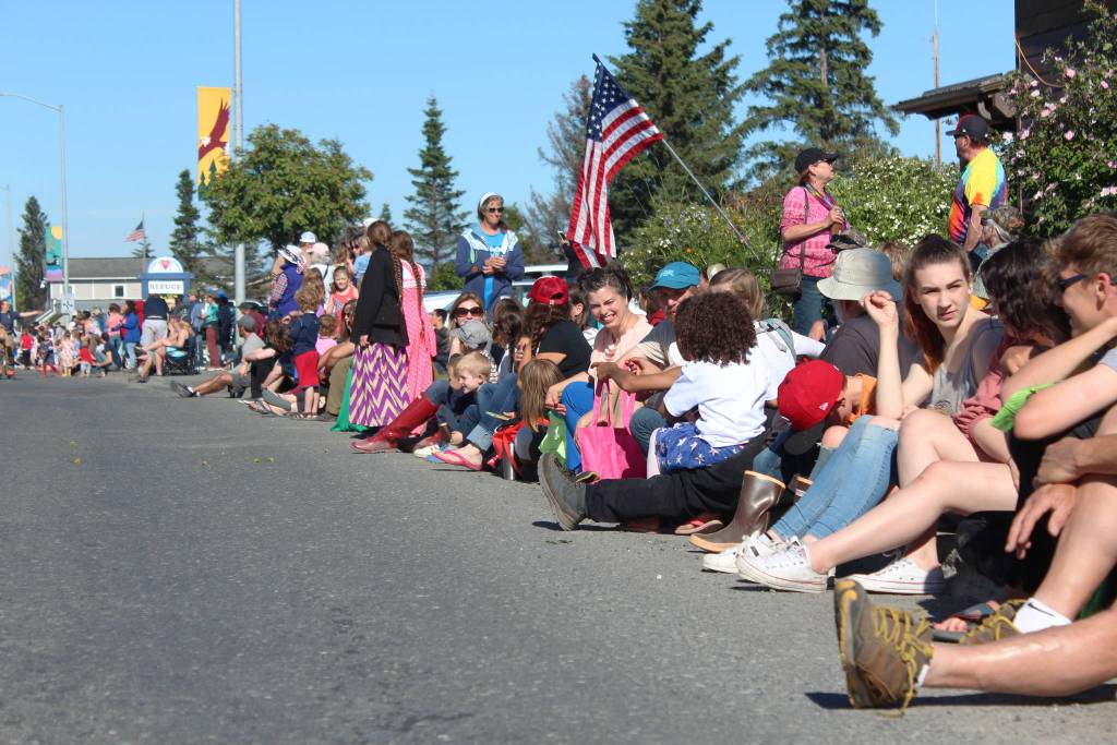 Homer area families line Pioneer Avenue in anticipation of this years Independence Day parade Wednesday, July 4, 2018 in Homer, Alaska. (Photo by Megan Pacer/Homer News).
