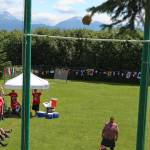 Zachary Fraley of Homer looks over his shoulder to chart the progress of a sheaf he tossed from a pitchfork, with the goal of getting it over the standard pole above him, at the Kachemak Bay Scottish Highland Games on Saturday, July 7, 2018 at Karen Hornaday Park in Homer, Alaska. (Photo by Megan Pacer/Homer News)
