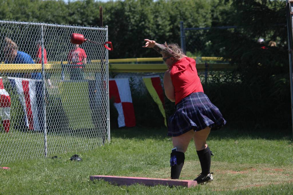 Sherri Borchert of Anchorage launches a weight during the heavy weight throw at this years Kachemak Bay Highland Games on Saturday, July 7, 2018 at Karen Hornaday Park in Homer, Alaska. (Photo by Megan Pacer/Homer News)