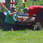 Kachemak Bay Scottish Club President Robert Archibald (right) and another volunteer repair a hammer that was broken during the hammer throw events of this years Kachemak Bay Scottish Highland Games on Saturday, July 7, 2018 at Karen Hornaday Park in Homer, Alaska. The hammer was repaired and the competition was able to continue. (Photo by Megan Pacer/Homer News)