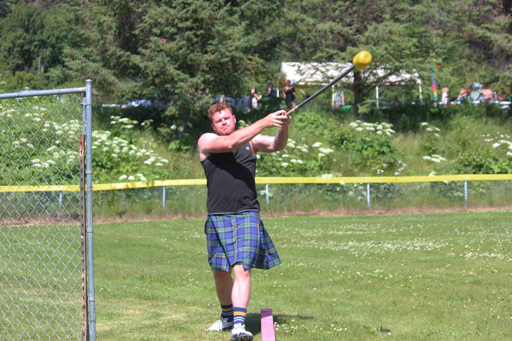 Zachary Fraley of Homer throws a hammer during the hammer throw portion of this years Kachemak Bay Scottish Highland Games on Saturday, July 7, 2018 at Karen Hornaday Park in Homer, Alaska. (Photo by Megan Pacer/Homer News)