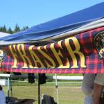 A clan booth advertises the Fraser clan at this years Kachemak Bay Scottish Highland Games on Saturday, July 7, 2018 at Karen Hornaday Park in Homer, Alaska. (Photo by Megan Pacer/Homer News)