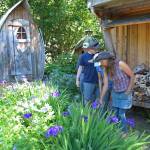 Ranja Dean leads a tour through her extensive gardens Friday, July 6, 2018 at her home off East End Road near Homer, Alaska. She and her husband host tours of their property and art studio. (Photo by Megan Pacer/Homer News)