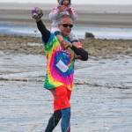 Dennis Mackulin approaches the finish line of the Chariots of Fur 5K race with Isabel Piek on Saturday, July 14, 2018 near Mariner Park in Homer, Alaska. Now in its third year, the race benefits Homer Animal Friends. (Photo by Megan Pacer/Homer News)