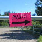 A sign points the way to this years Mud Wallow festivities Sunday, July 22, 2018 at Cottonwood Horse Park on East End Road in Homer, Alaska. (Photo by Megan Pacer/Homer News)
