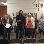 Above, the vocal ensemble for the Spring Cabaret rehearses at the Homer Council on the Arts last Saturday. From left to right are Sarah Frary, Paula Kulhanek, Suzanne Singer Alvarez, Britny Bradshaw, Katelyn Wythe, Erik Larson, Krystal Butcher, Maggie Goedeke, Hannah Heimbuch, Jennifer Norton and Hal Spence on guitar. Not pictured is singer Bobbye Triplett Hurd.-Photo by Nicole Luchaco