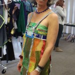 Models try on some of the pieces that will be featured in Saturday’s Wearable Arts show. Melisse Reichman shows off her own creation, Juicy, created from the net-like fibers of fresh-fruit bags.-Photo by McKibben Jackinsky, Homer News